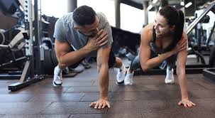 Toning Bingo Wings: Your Ultimate Guide to Sculpting Sleek Arms at the Gym 3 Fitness trainer demonstrating arm toning exercises Hove