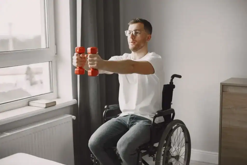 Image of man doing exercise in his wheelchair to aid weight loss Hove