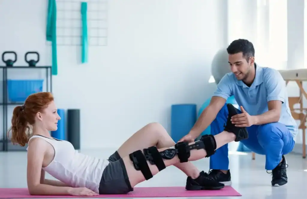 Woman having treatment to help muscle recovery Hove after an injury